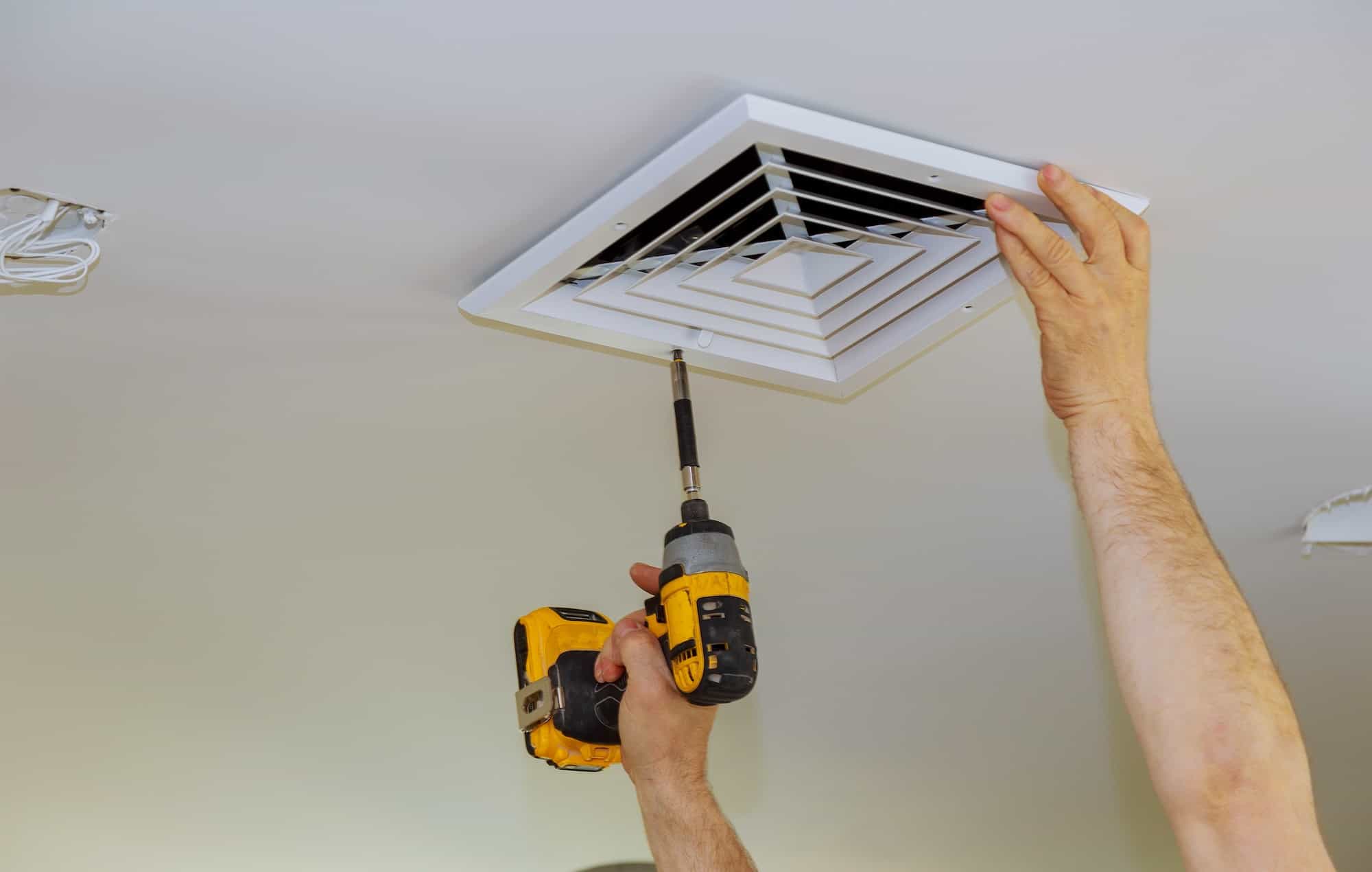 the-process-of-installing-mounting-skin-ceiling-covered-by-plastic-ventilation-cover-in